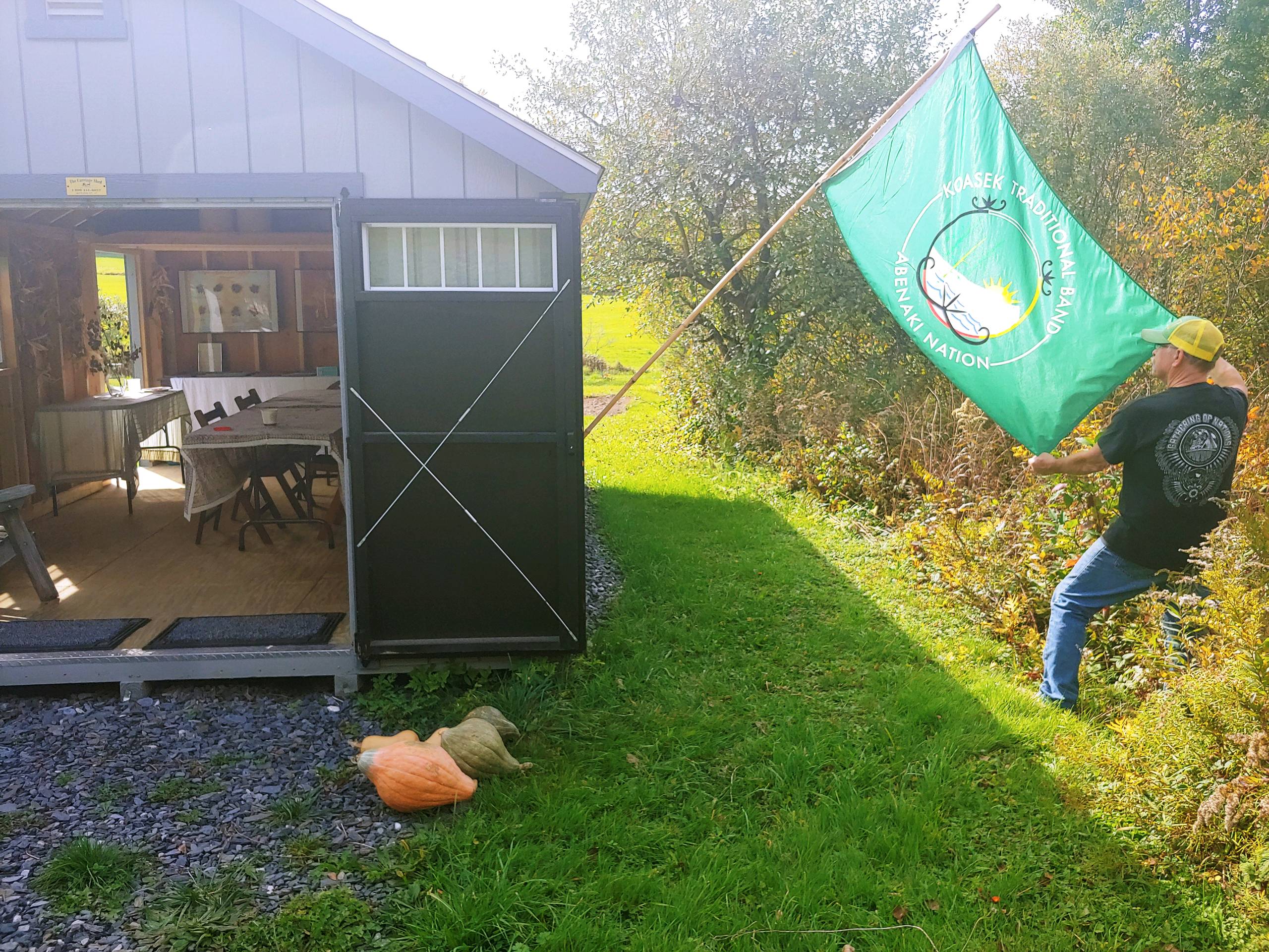 Doug Bent opens the doors to educational hut adjacent the tribal garden in Braintree