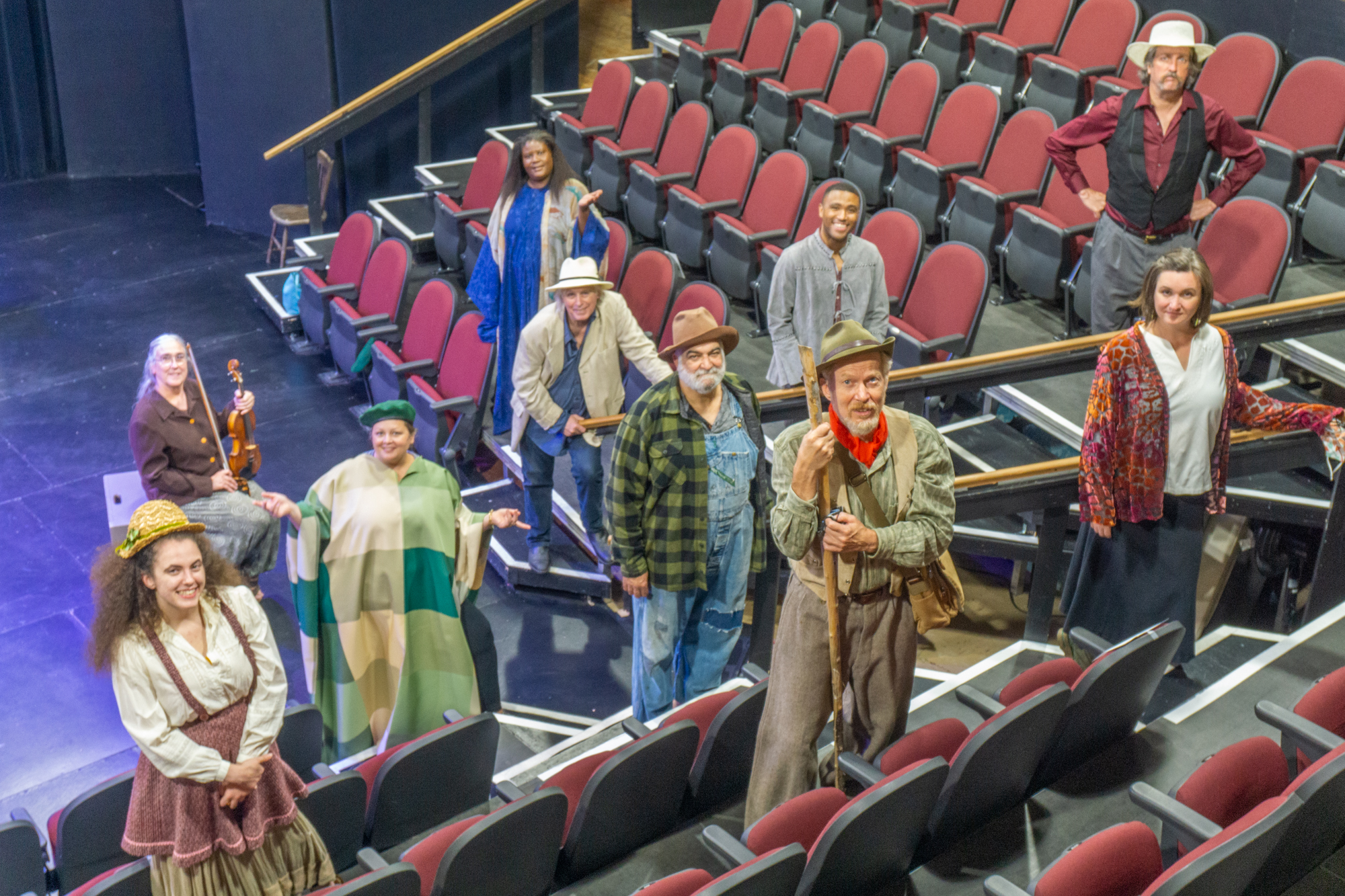 cast in theater on steps by John Snell