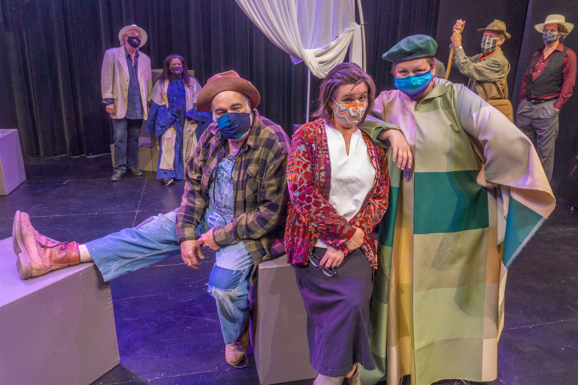 Corin, Touchstone & Audrey clown around downstage while rest of the cast watches. photo by John Snell